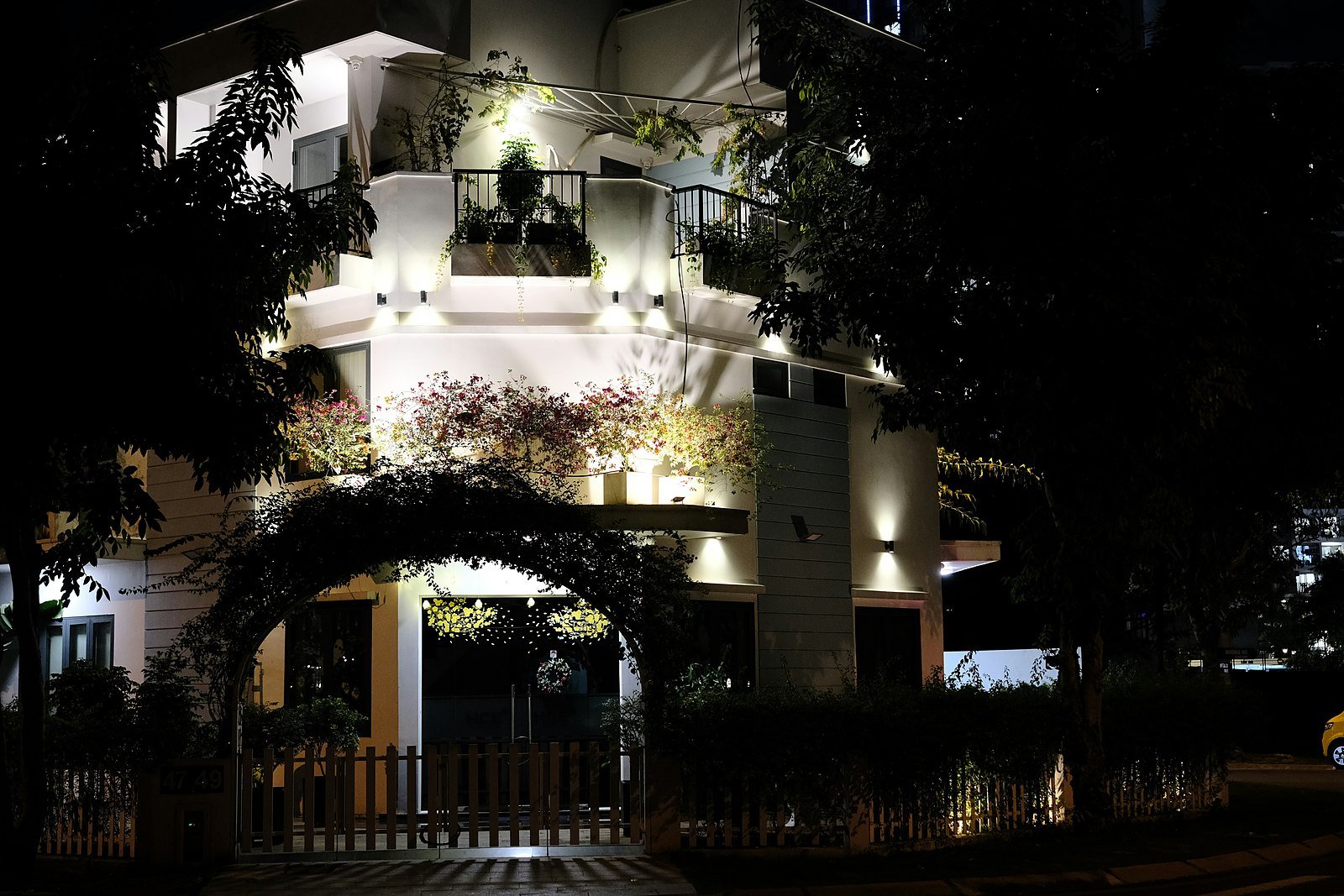 Contemporary residence illuminated at night — representational imagery